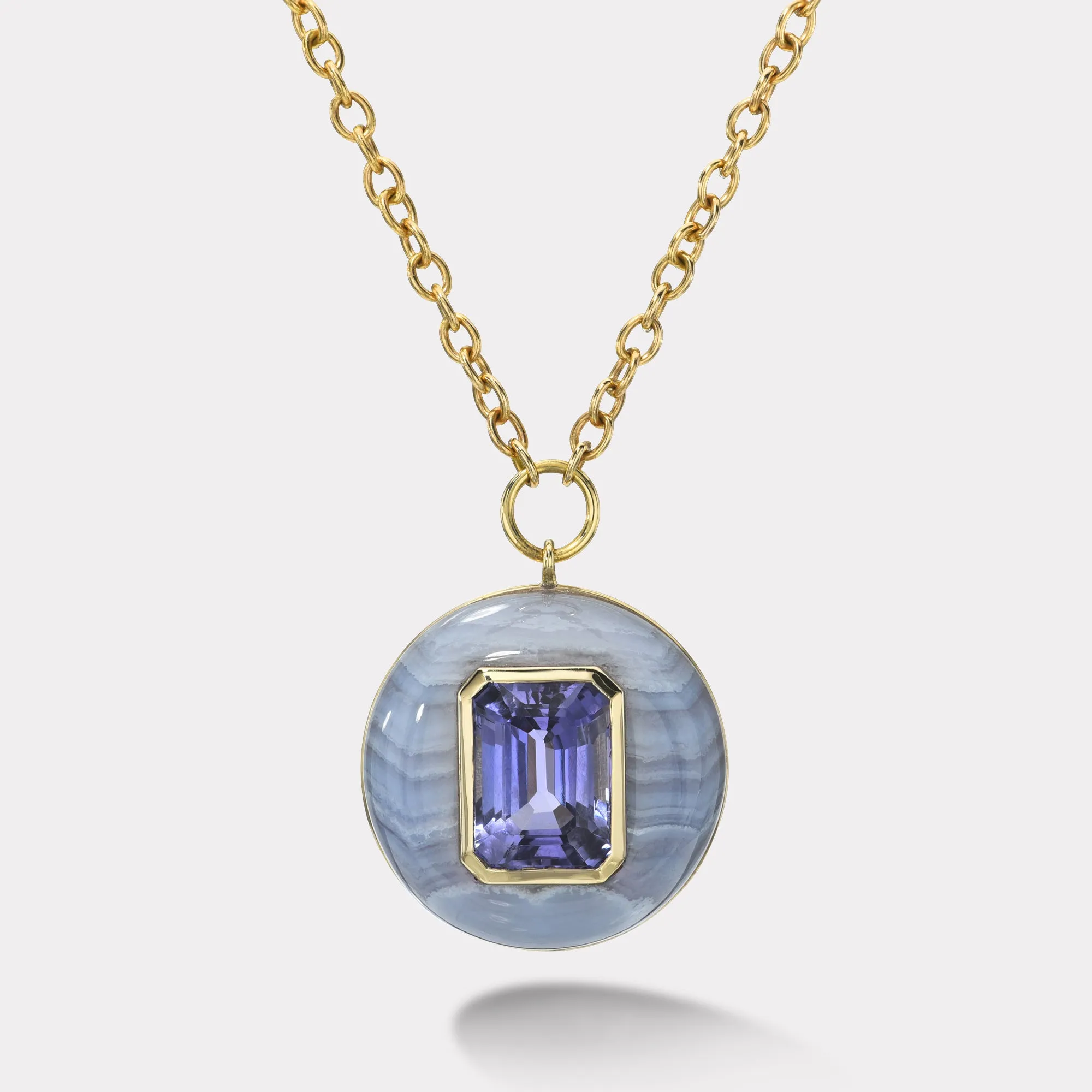 10.1ct Emerald Cut Tanzanite in Hand Carved Blue Lace Agate Lollipop Pendant