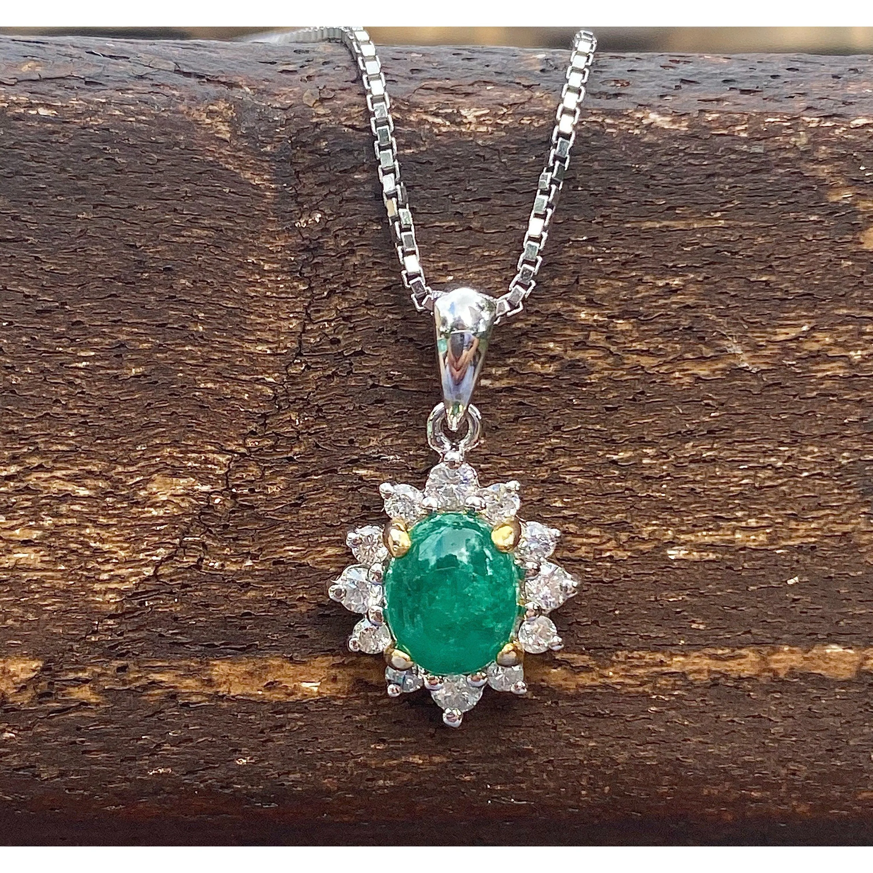 Cabochon Cut Emerald and Diamond pendant in 18k white gold floral/star design